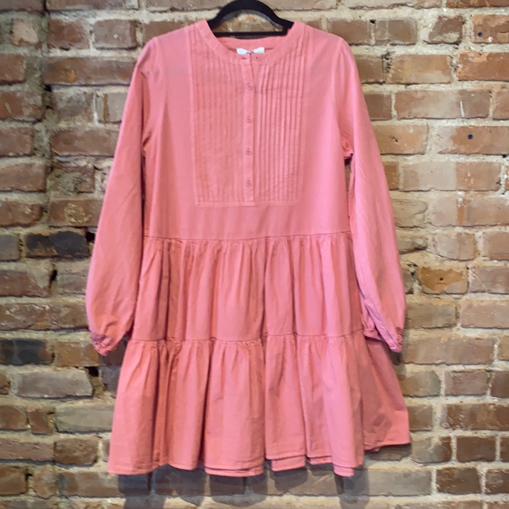 Best selling pink dress with buttons.
